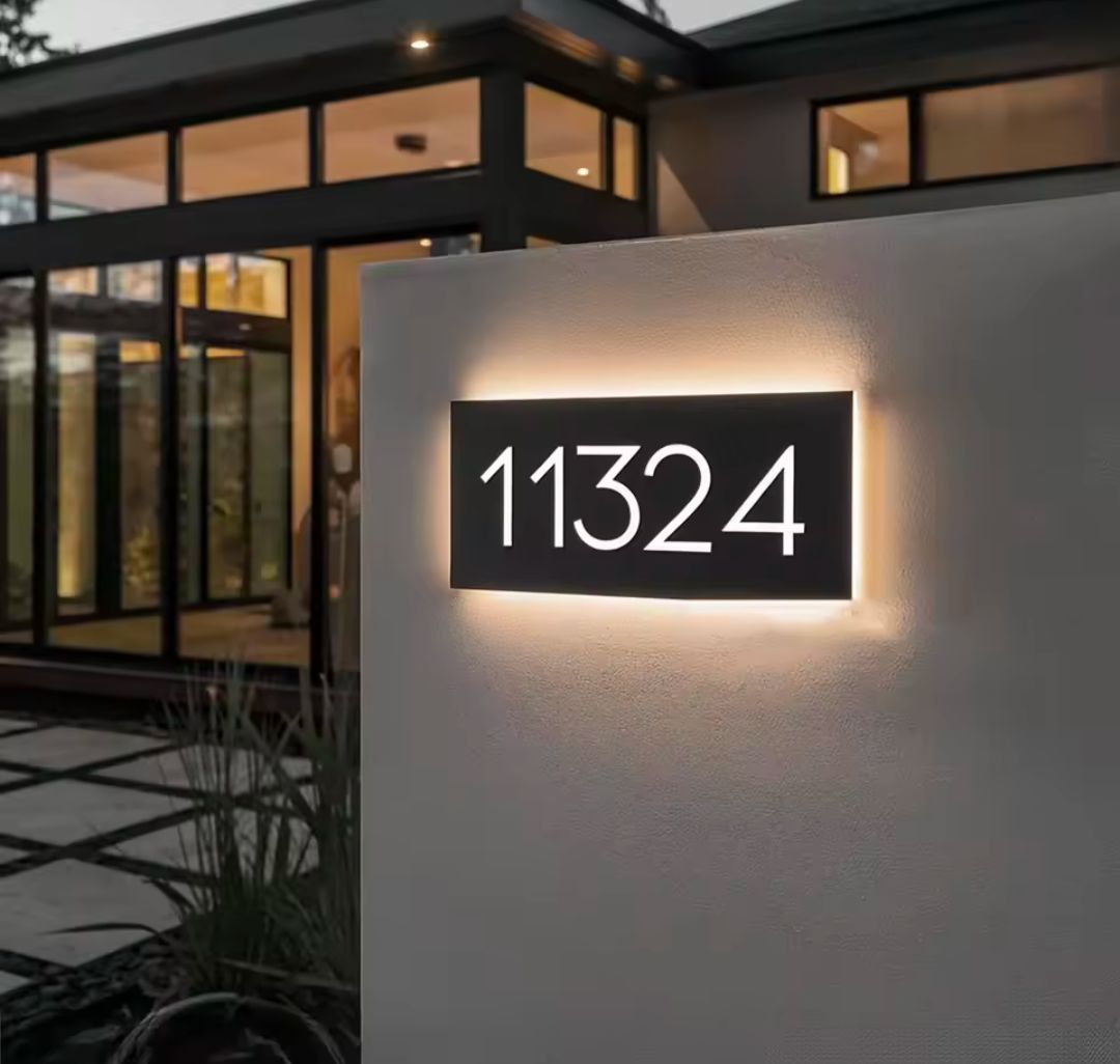 Custom warm white LED light-up house letterbox address sign with modern rectangular design mounted outdoors.