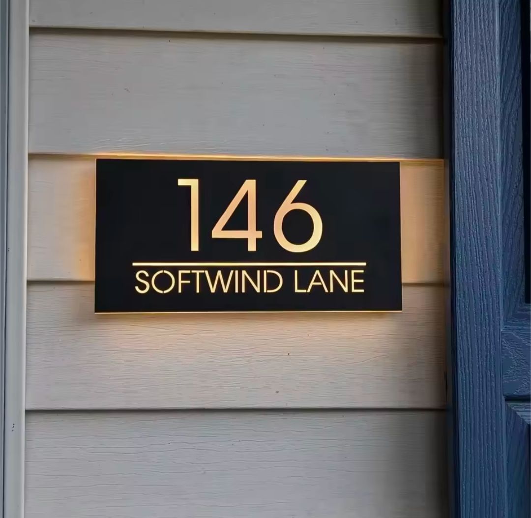 Custom warm white LED light-up rectangular house letterbox address sign displaying 146 Softwind Lane.
