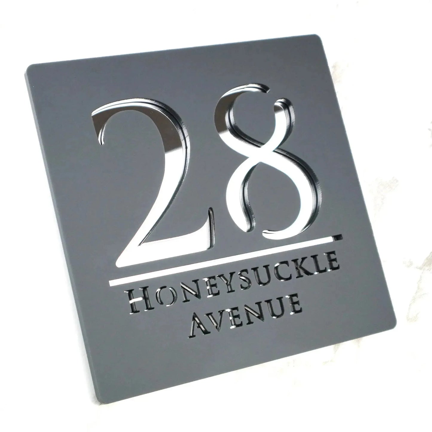 Square custom acrylic house letterbox sign with cut-out number 28 and Honeysuckle Avenue text in modern style