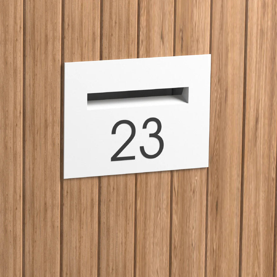white mailbox installed in a timber fence with the number 23