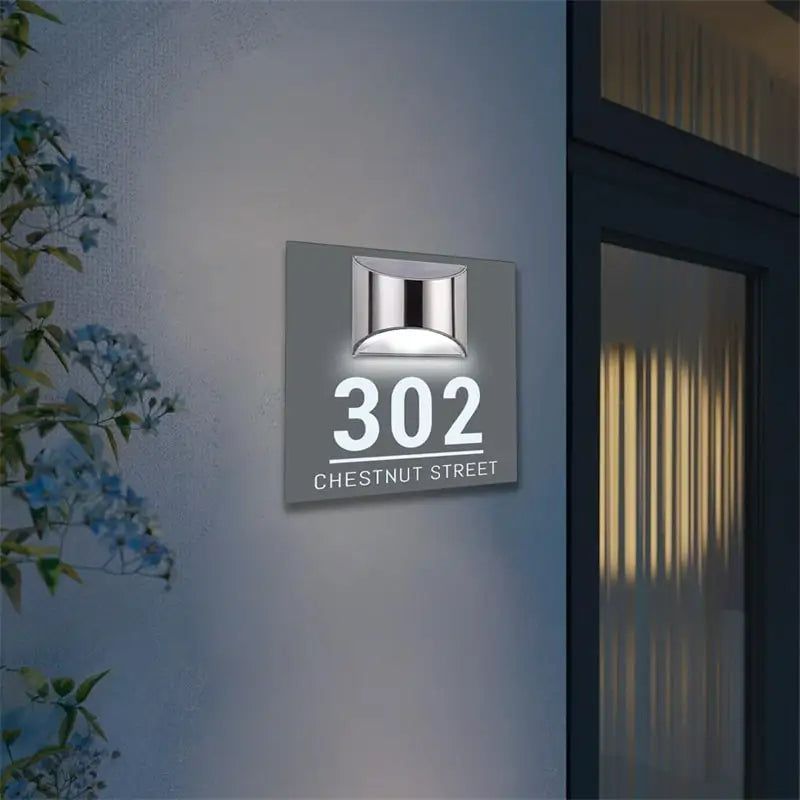 Square solar-powered acrylic house sign with illuminated address number 302 and street name Chestnut Street